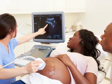 Ultrasound examination of pregnant woman in hospital.
