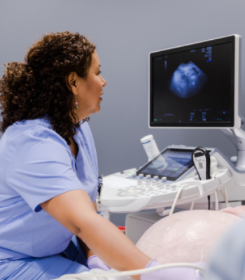 Sonographer performing prenatal fetal ultrasound scan