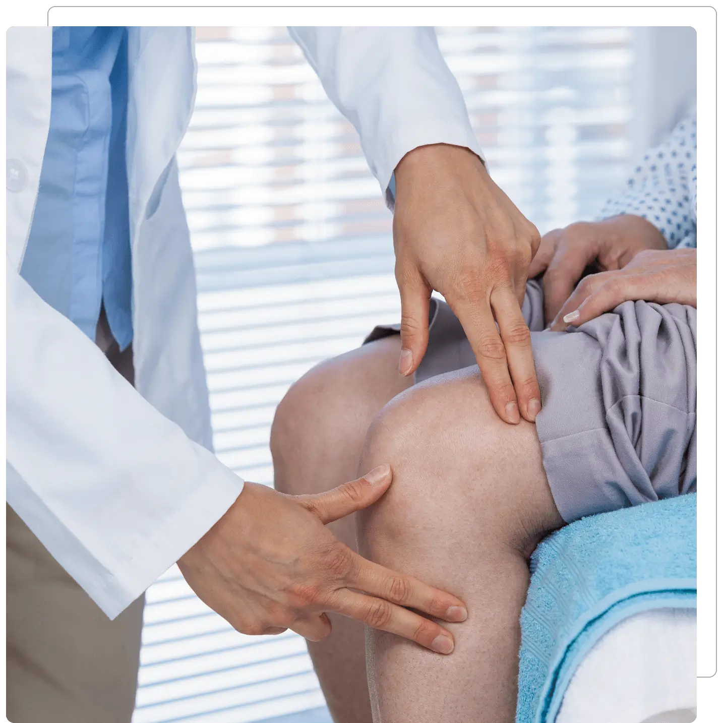 Doctor examining patient's knee joint